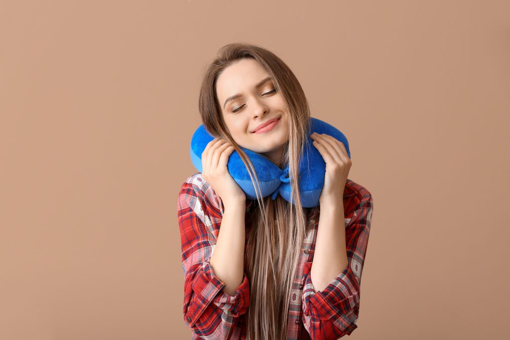 women using travel pillow 